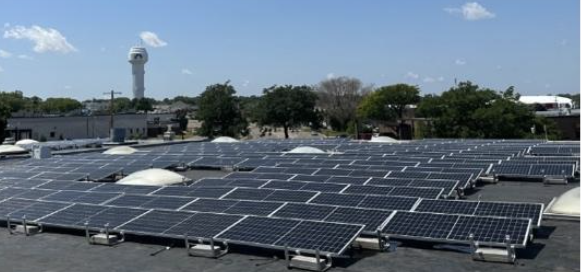 Commercial solar panel installation by Wolf River Electric, showcasing rooftop solar systems optimizing energy efficiency."